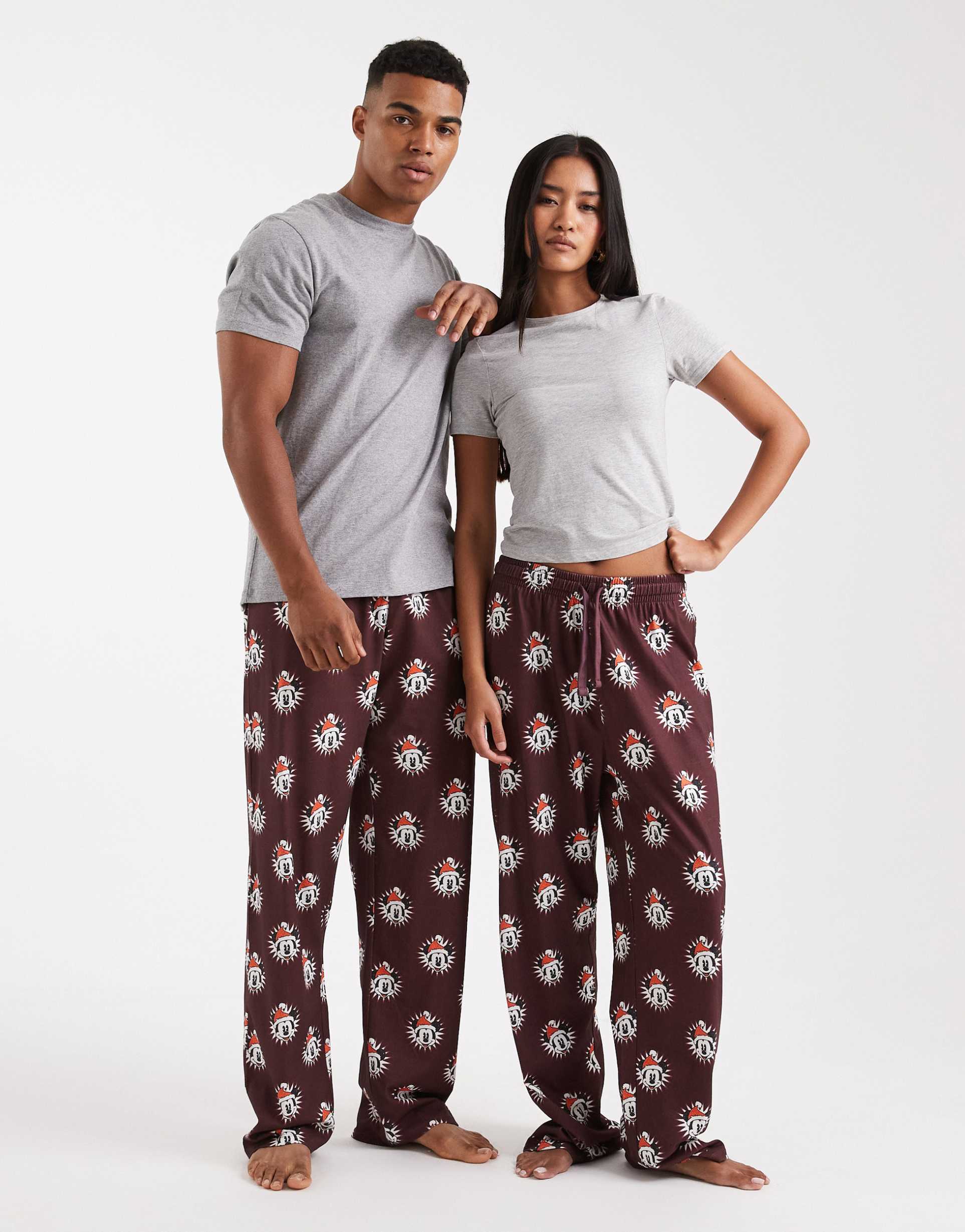 asos design lounge bottoms with disney's christmas mickey mouse graphics in burgundy