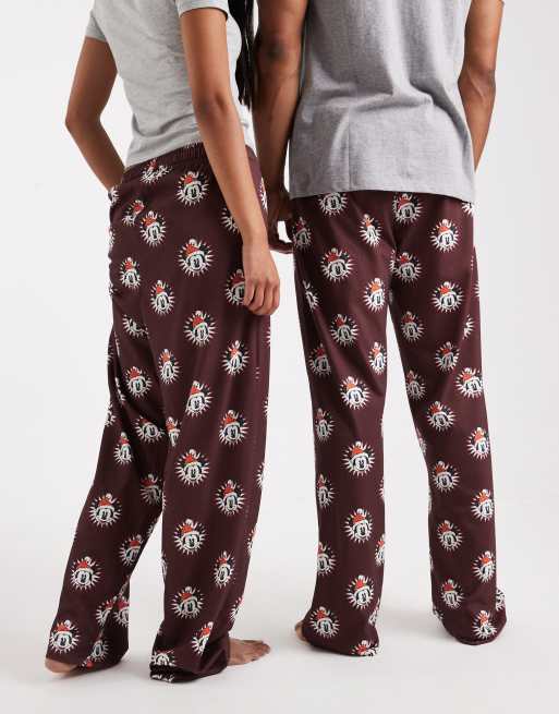 ASOS DESIGN lounge bottoms with Disney's Christmas Mickey Mouse graphics in burgundy
