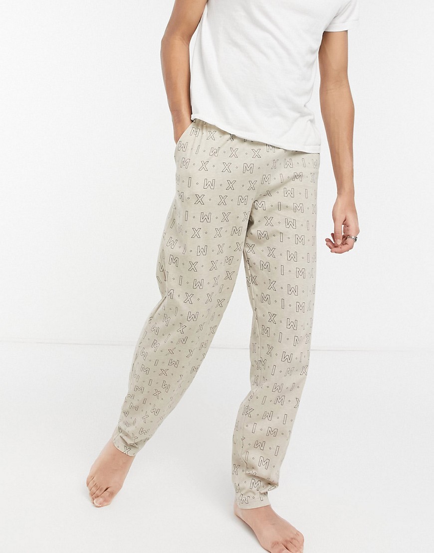 ASOS DESIGN lounge pants with Roman numeral print-Neutral