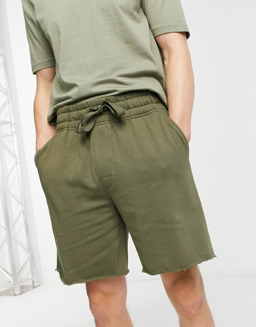 ASOS DESIGN lounge relaxed jersey shorts with raw hem in khaki-Green