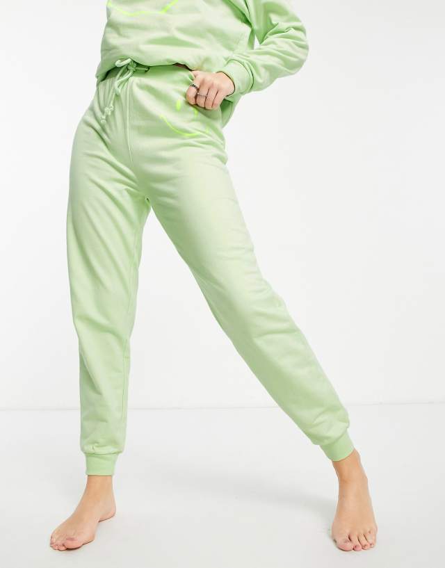 ASOS DESIGN lounge Smiley sweatpants in lime - part of a set