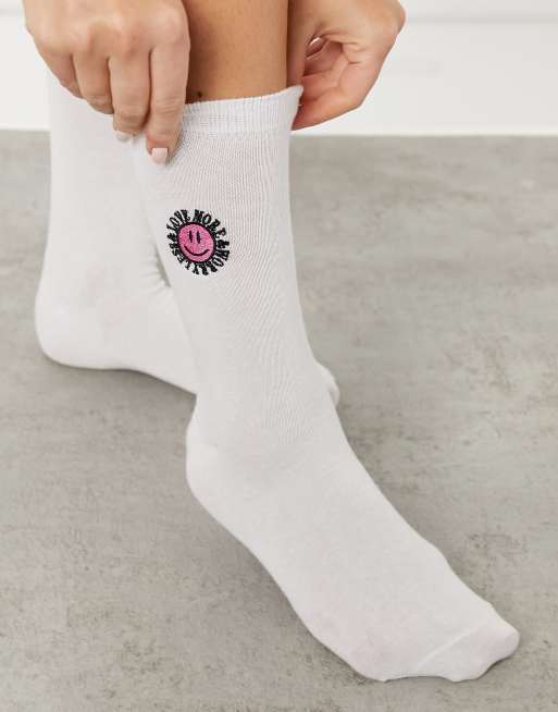 ASOS Weekend Collective calf length socks with embroidered logo in white