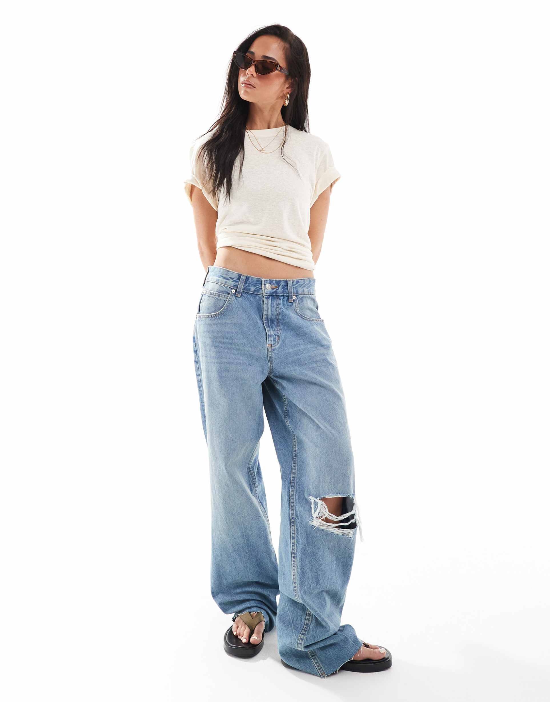 asos design low rise baggy jeans with rips in mid blue