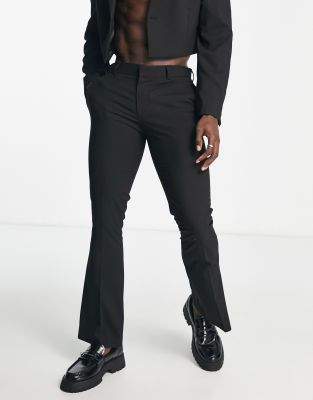 ASOS DESIGN low rise flare pants with strap detail and ruched waist in black  - ShopStyle Wide-Leg Trousers