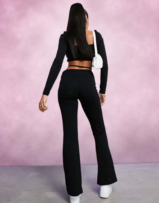 ASOS DESIGN low rise flare pants with strap detail and ruched waist in black