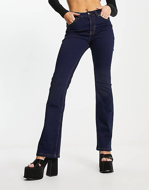 ASOS DESIGN low rise flared jeans with western pocket detail in dark blue