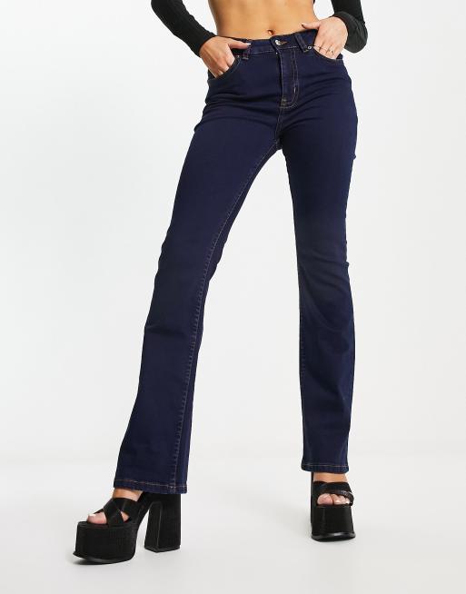 ASOS DESIGN low rise flared jeans with western pocket detail in dark blue