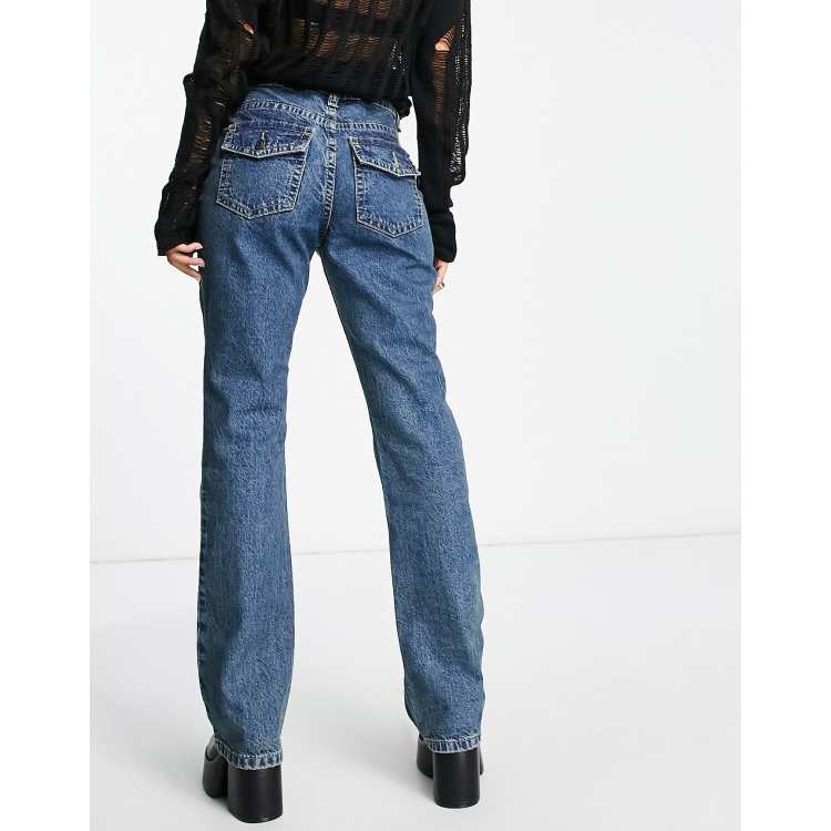 ASOS DESIGN Full length flare jeans with wrap waist band and cut about seam  detail in mid green blue wash