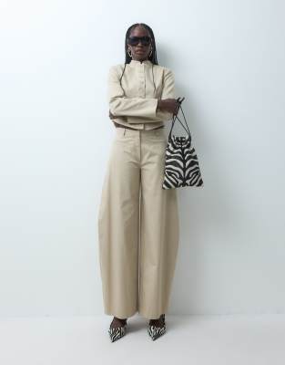 Asos Design Low Rise Horseshoe Leg Pants In Neutral