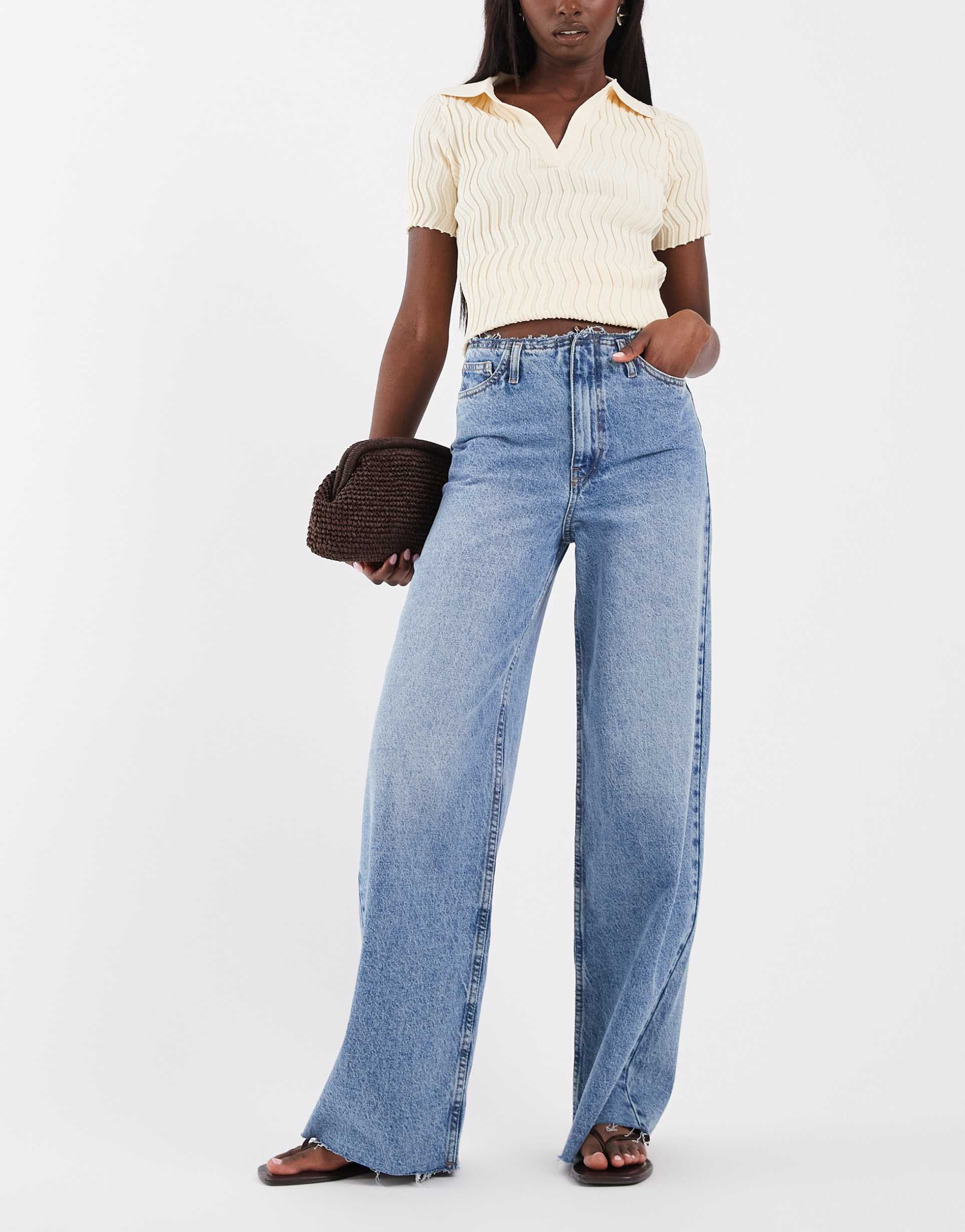 asos design low rise raw waistband straight leg jeans in blue wash
