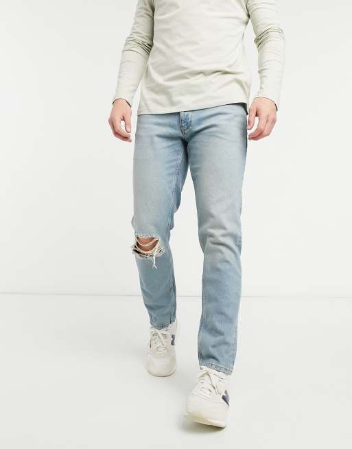 ASOS DESIGN low rise slim jeans in vintage mid 90's wash with knee rip