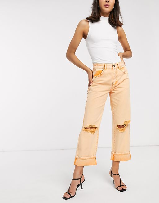 ASOS DESIGN low slung carpenter jeans with extreme rips in orange | ASOS