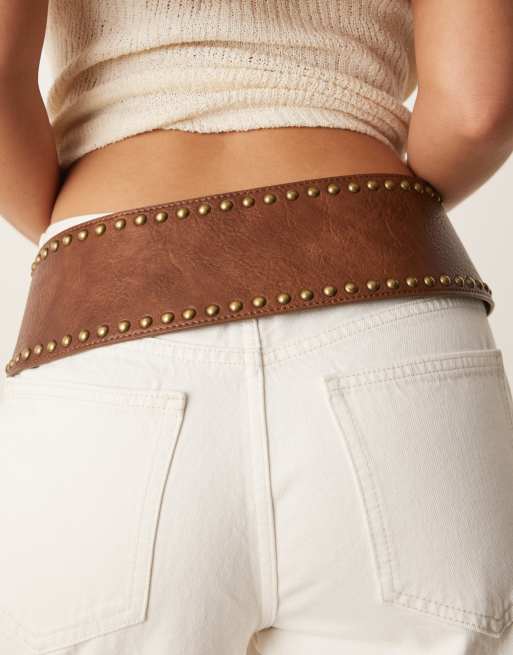 ASOS DESIGN low waist wide belt with stud details in tan ASOS