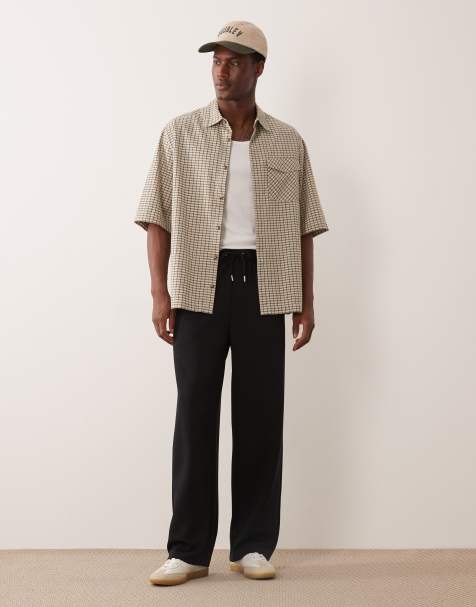 ASOS DESIGN luxe wide leg trackies in black - view 1
