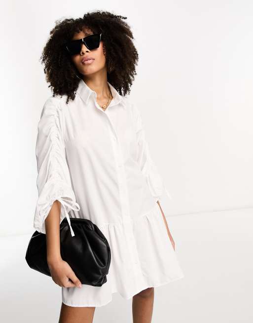 ASOS DESIGN – Luźna biała sukienka koszulowa z falbanką u dołu z bawełny