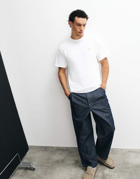 ASOS DESIGN – Luźne jeansy w kolorze surowego denimu ze zwężanymi nogawkami z zakładkami i klamrą - view 1