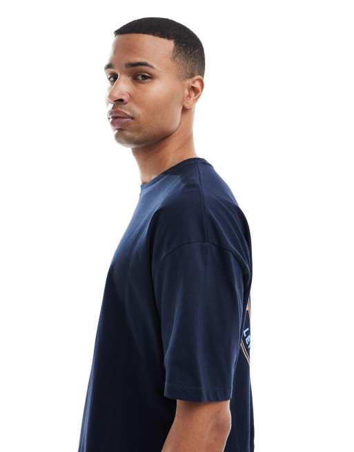 ASOS DESIGN - Lysebrun oversized T-shirt med grafisk sportsprint, 4 af 5
