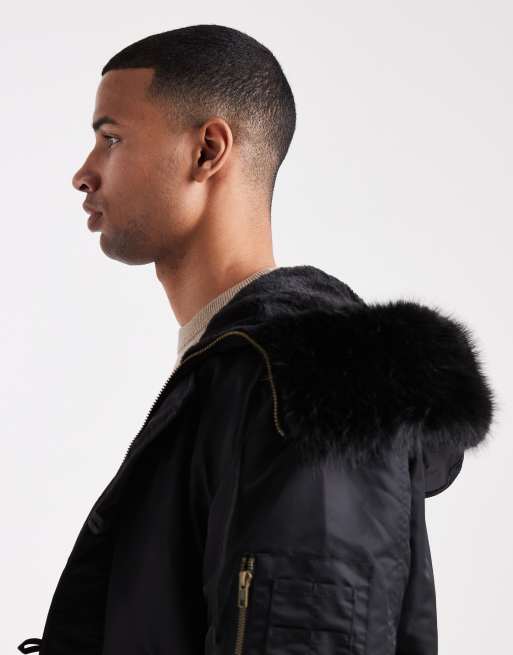 ASOS DESIGN – MA1-Bomberjacke in Schwarz mit Oversize-Schnitt und Kapuze mit Kunstpelzbesatz, 4 von 5