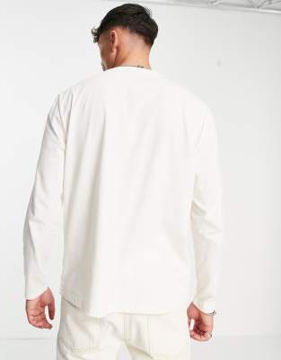 Maglietta comoda a maniche lunghe bianco sporco con stampa stile college - ASOS DESIGN T-shirt donna  - immagine3