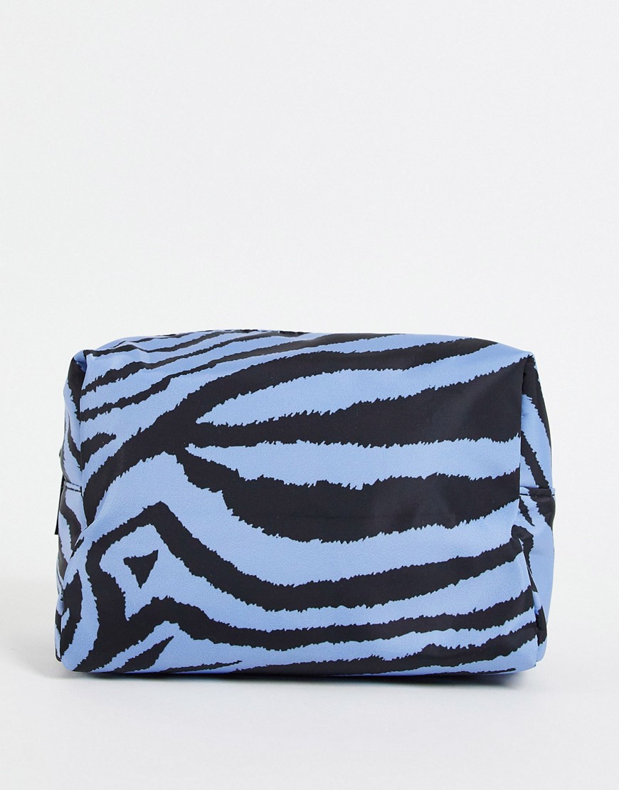 ASOS DESIGN makeup bag in blue zebra print