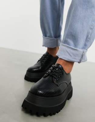 black flat tie up shoes