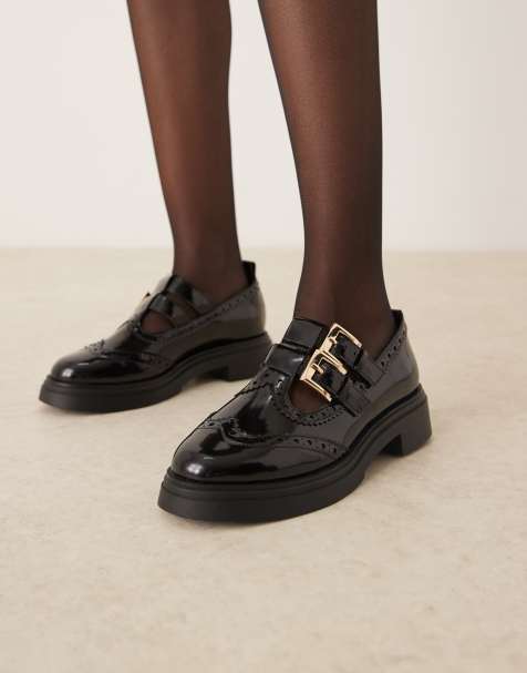 ASOS DESIGN Marigold chunky buckle detail flat shoes in black - view 1