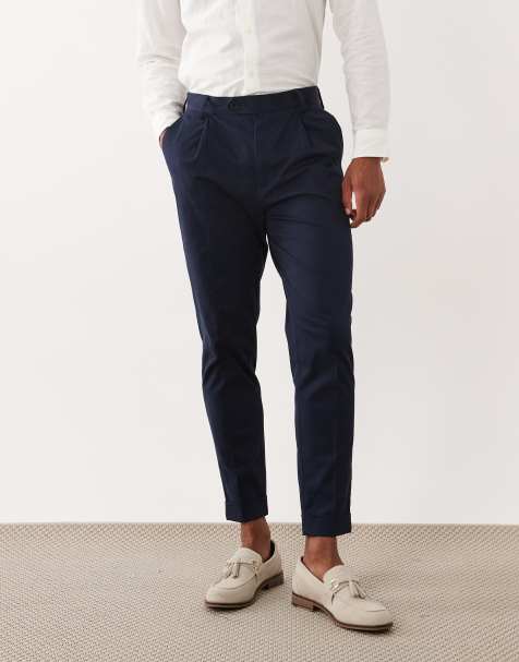 ASOS DESIGN – Marinblå, figursydda, avsmalnande chinos i bomullsrikt tyg med uppvikt kant - view 1