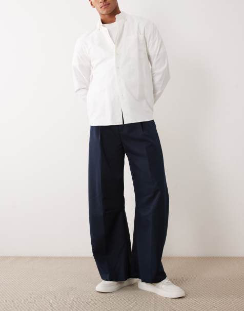 ASOS DESIGN – Marinblå, figursydda byxor med barrelben - view 1