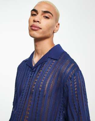 ASOS DESIGN – Marinblå hålstickad pikétröja med avslappnad passform och platt krage  