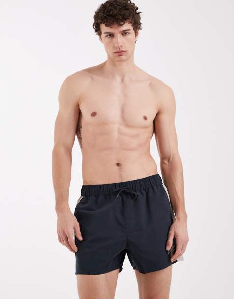 ASOS DESIGN – Marinblå, mellanlånga badshorts med broderi - view 1