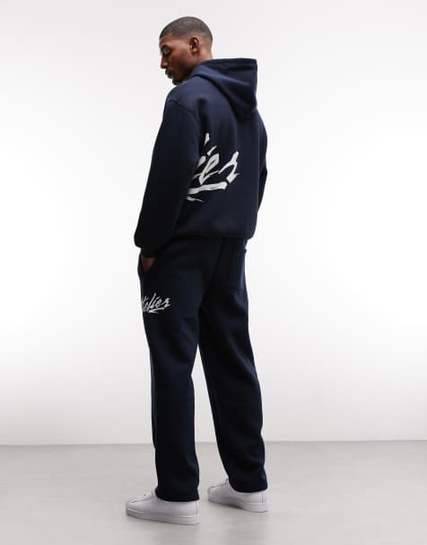 ASOS DESIGN – Marinblå mjukisbyxor med raka ben och texttryck - view 1