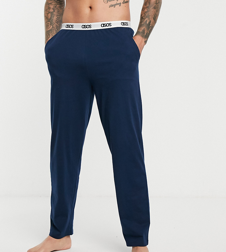 ASOS DESIGN – Marinblå pyjamasbyxor med logga på midjebandet