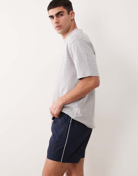 ASOS DESIGN – Marinblå, vida, halvlånga shorts i elastisk nylon med passpoaler - view 1