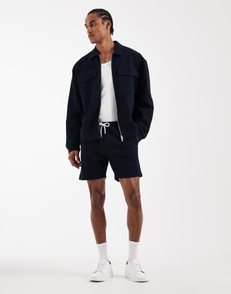 ASOS DESIGN – Marinblått, bubbligt och fiskbensmönstrat set med jacka med dragkedja, kort design och smal passform - view 1