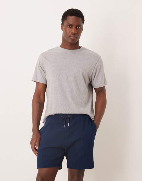 ASOS DESIGN - Marineblå jerseyshorts i Slim Fit med vaffeltekstur og pintucks - view 1