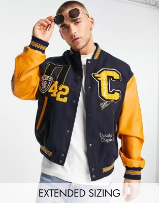 ASOS DESIGN - Marineblå oversized bomber-jakke i uldlook med college-design og kontrastærmer i læderlook