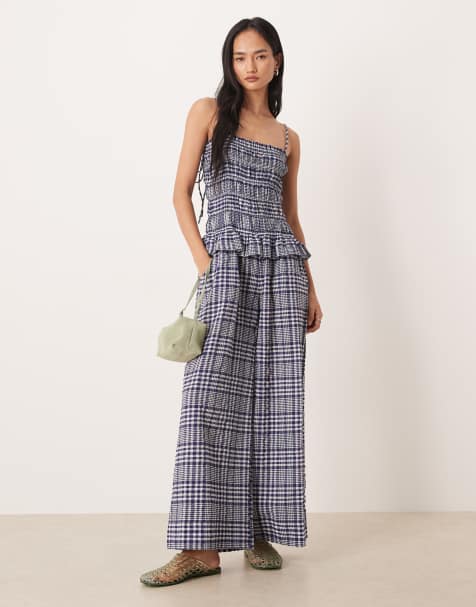 ASOS DESIGN - Marineblå rynket peplum-jumpsuit med gingham-tern - view 1