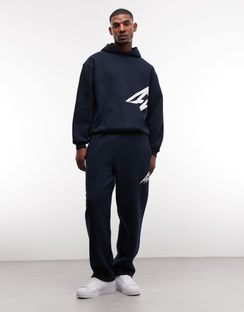ASOS DESIGN - Marineblåt sæt med oversized hættetrøje og joggingbukser med lige ben og tekstprint - view 1