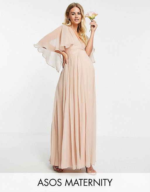 Dresses Maternity Bridesmaid ruched bodice drape maxi dress with wrap waist and flutter cape sleeve in blush 