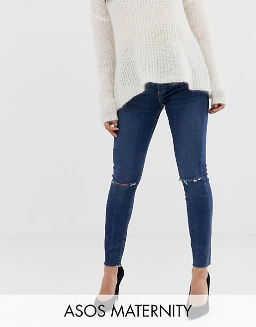 ASOS DESIGN Maternity high rise ridley 'skinny' jeans in dark wash blue with ripped knee detail with under the bump wai