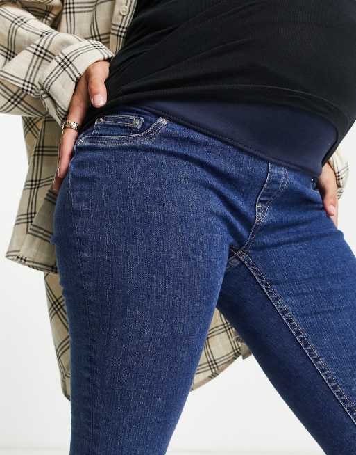 ASOS DESIGN Maternity high rise skinny jeans in mid blue with under the bump waistband, 3 of 4