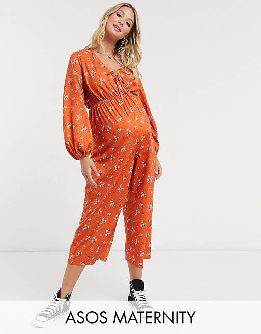 ASOS DESIGN maternity jersey tie front long sleeve jumpsuit in rust ditsy floral print