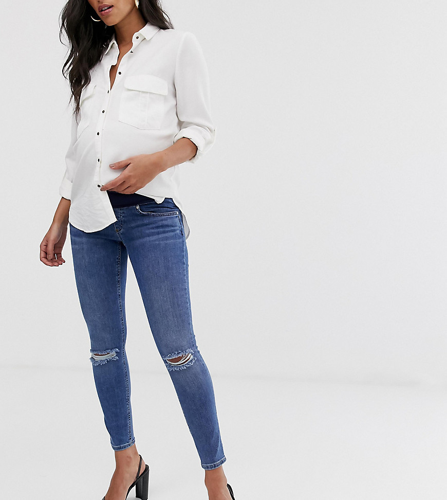 ASOS DESIGN Maternity - lisbon - Skinny jeans met halfhoge taille in mid wash blue met gerafelde kniescheuren en band over de buik-Blauw