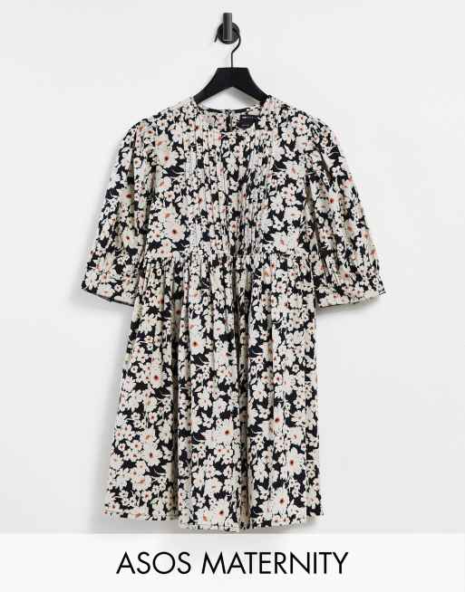 ASOS DESIGN Maternity - Mini-smockjurk met A-lijn en platgestikte plooitjes in madeliefjesprint