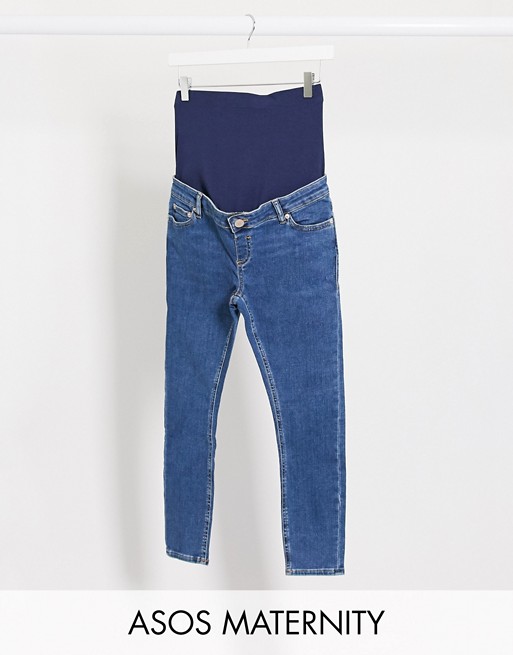 ASOS DESIGN Maternity Petite high rise ridley 'skinny' jeans in bright midwash blue with over bump waistband