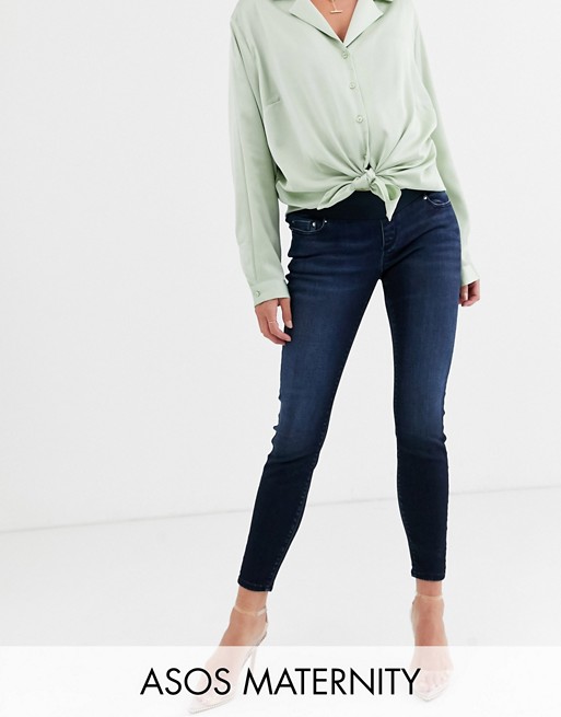 ASOS DESIGN Maternity high rise ridley 'skinny' jeans in blackened blue wash with under the bump waistband