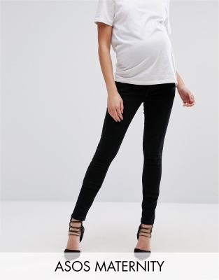 over the bump black skinny jeans