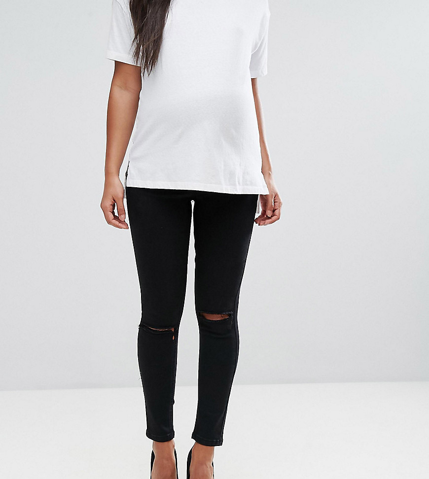 ASOS DESIGN Maternity Ridley high waisted skinny jeans in clean black with ripped knees with over the bump waistband