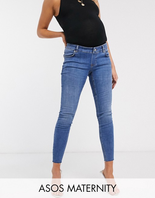 ASOS DESIGN Maternity high rise ridley 'skinny' jeans in mid wash blue with over the bump band