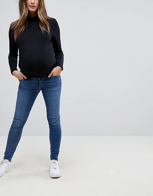 ASOS DESIGN Maternity Ridley high waisted skinny jeans in mid wash blue with over the bump waistband